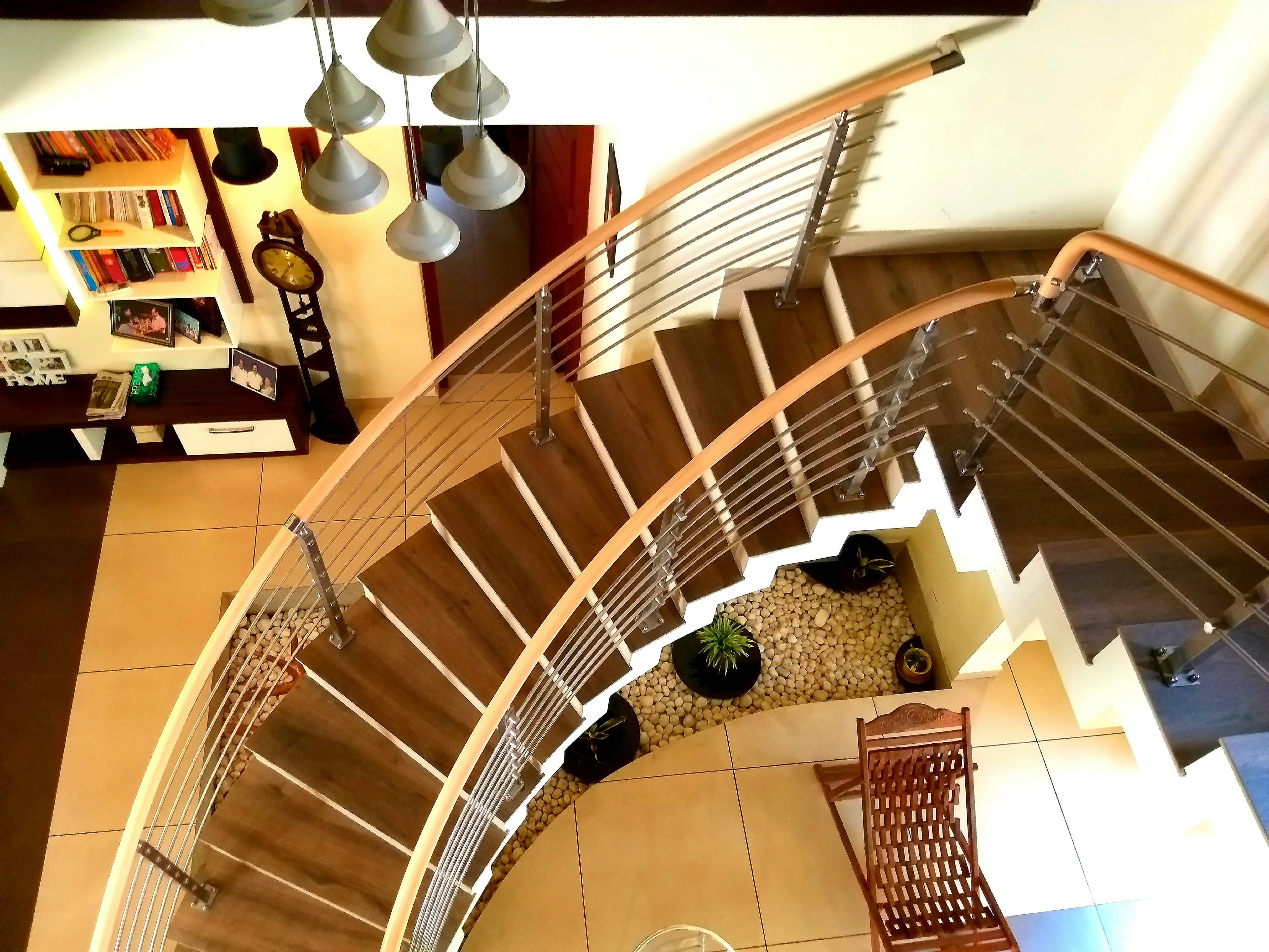 Sculptural custom staircase with open rises and precise metal detailing