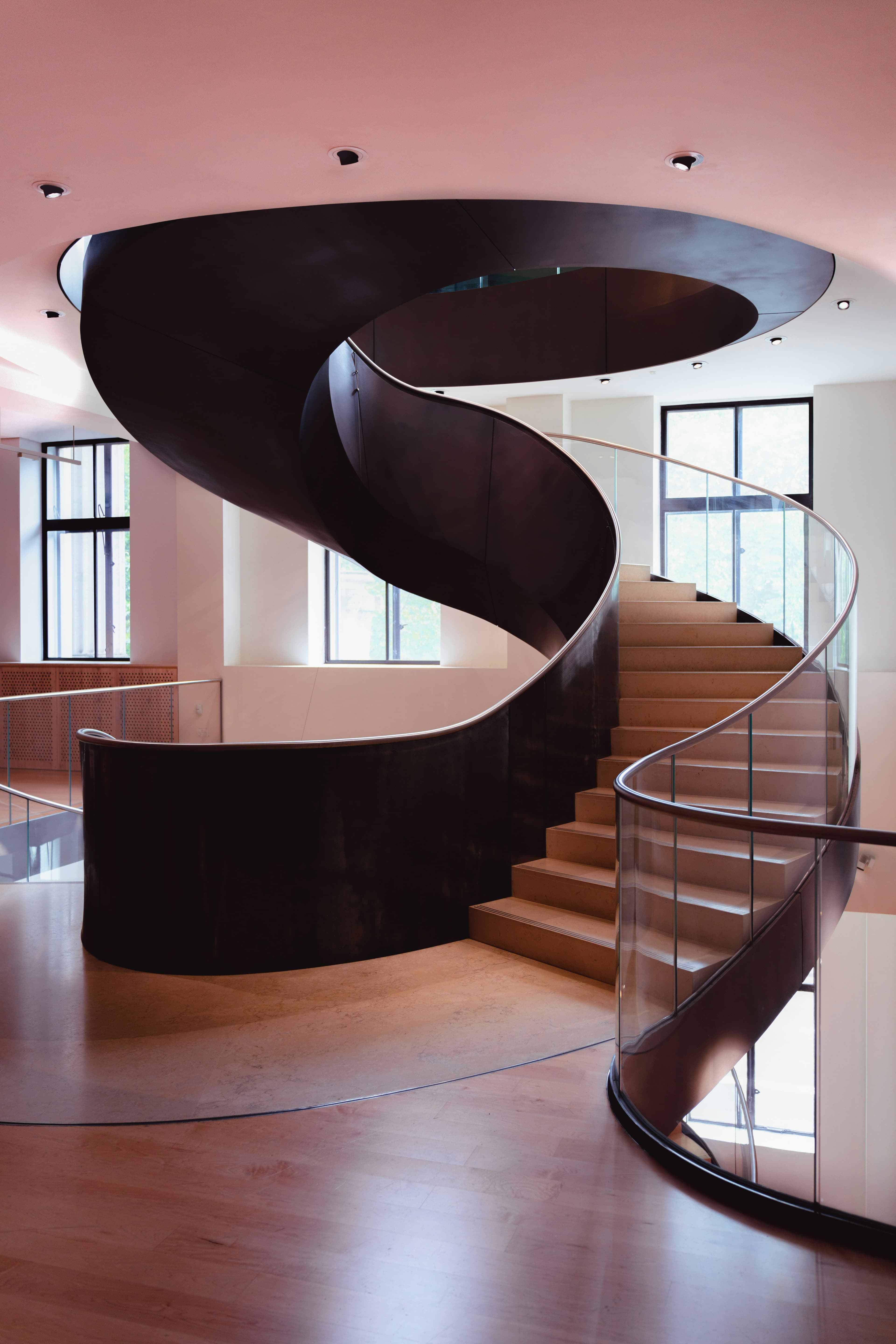Floating custom staircase volume in a bright contemporary interior