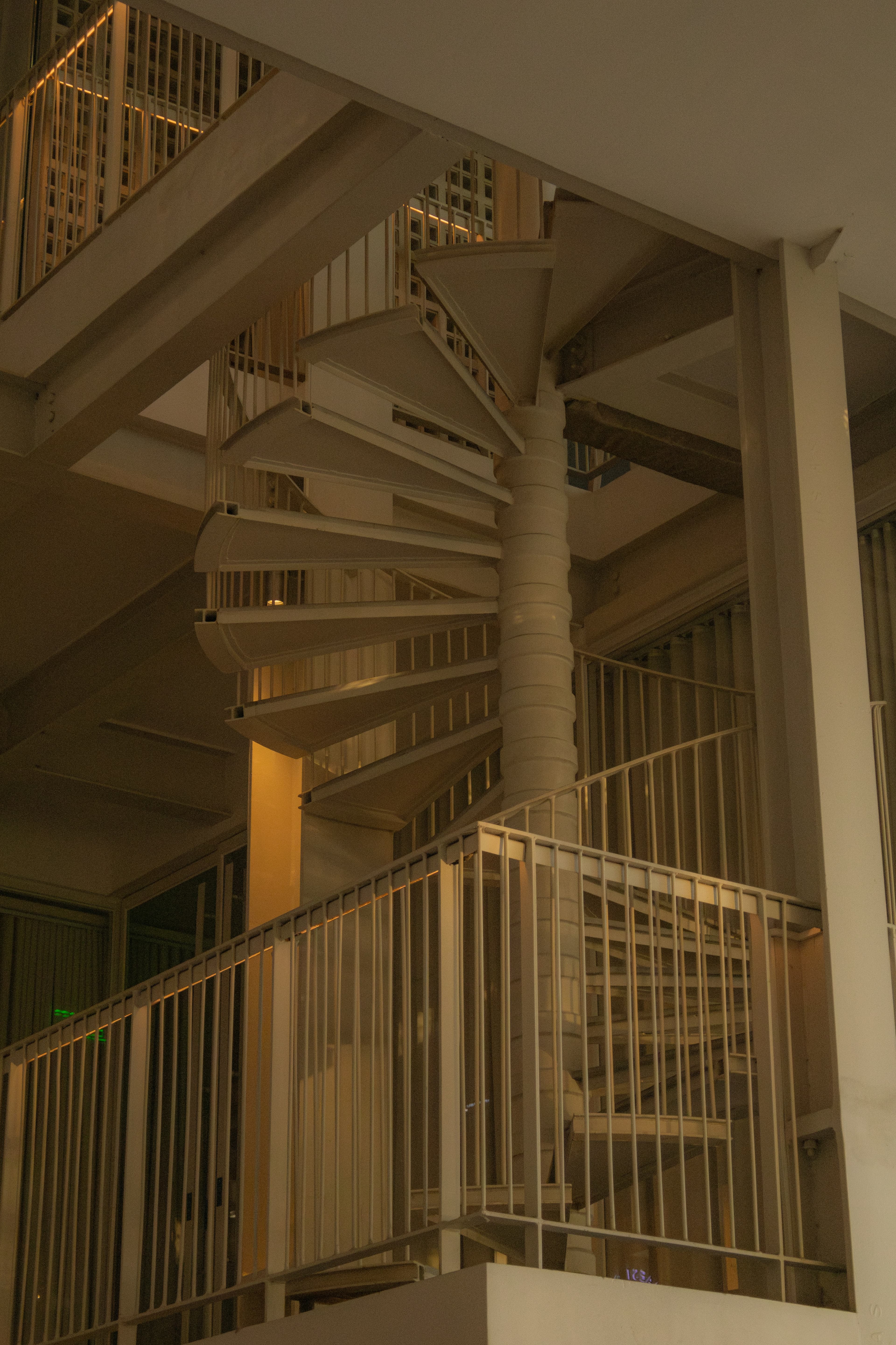 Custom staircase with glass edge detailing and stainless accents