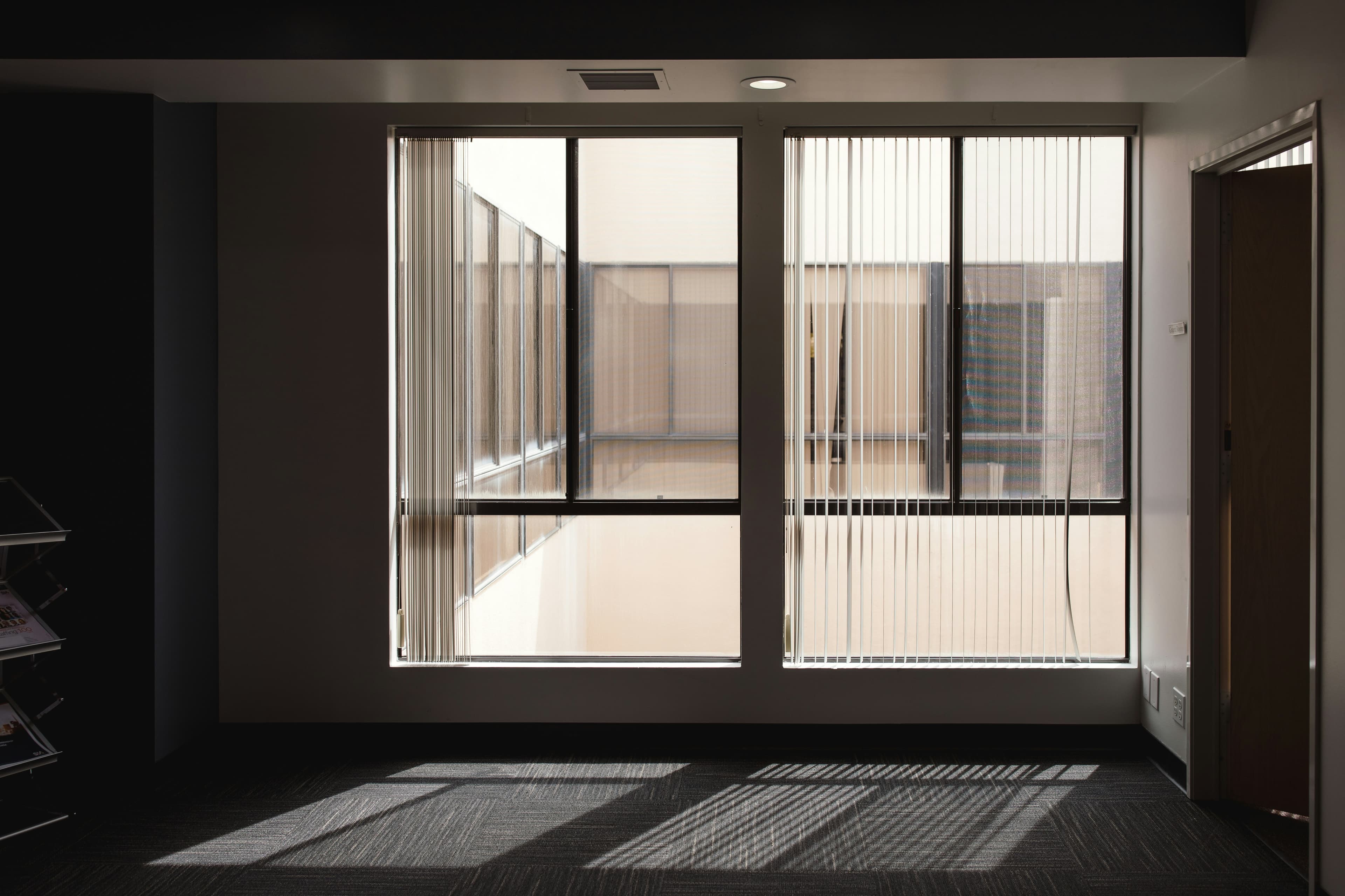 Framed protective grill over a contemporary window opening