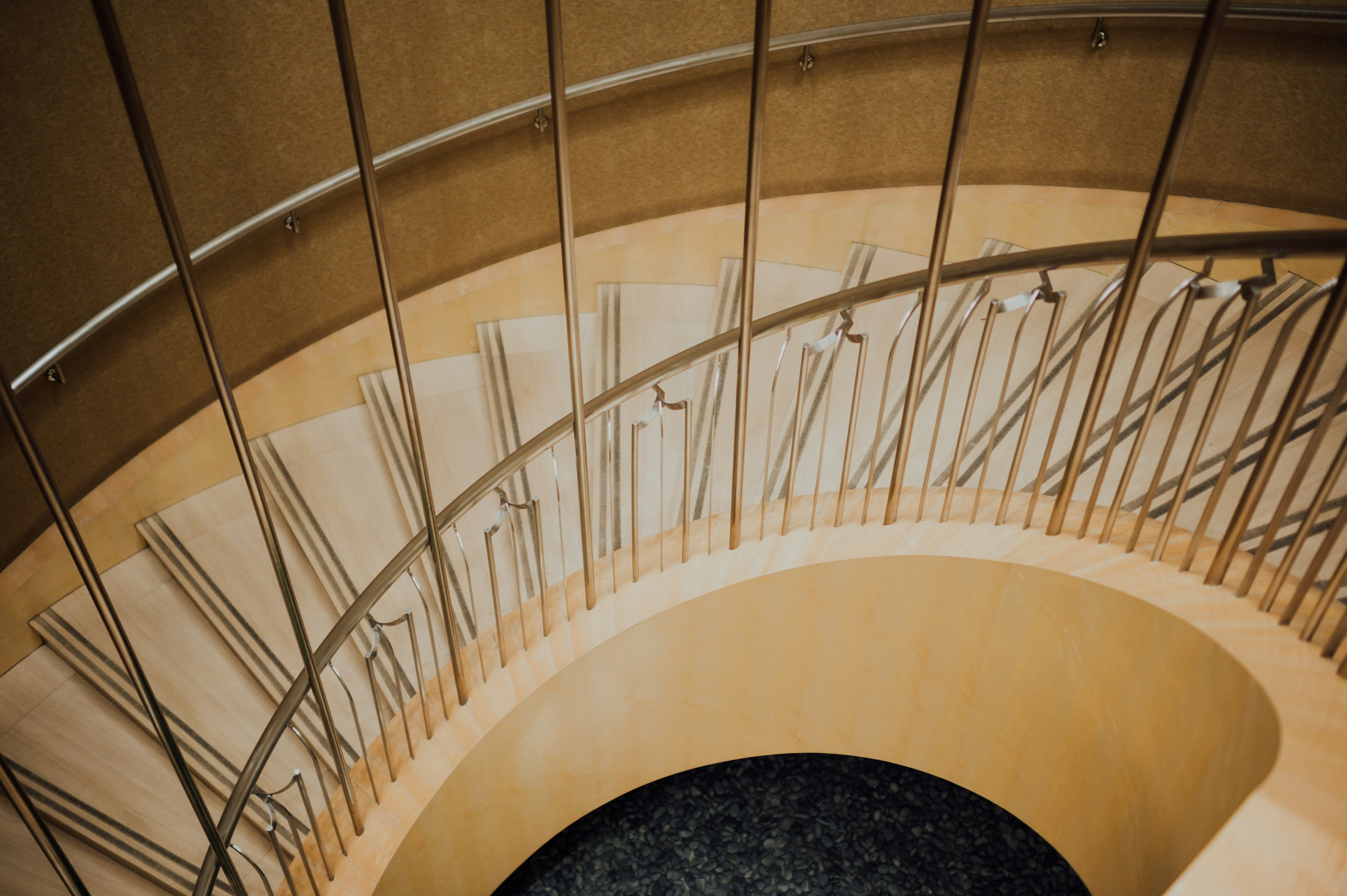 Stainless steel handrail along a contemporary stair