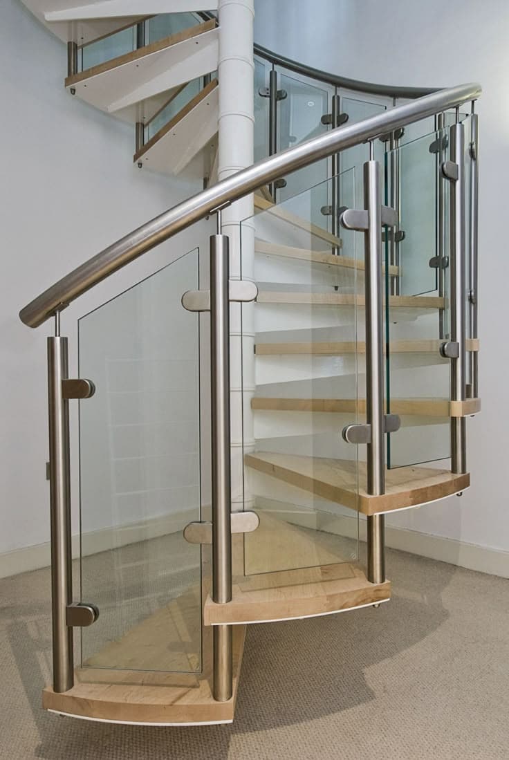 SS railing — Close Up Of Modern Spiral Staircase With Wooden Steps With Open Risers Glass And Steel Make Up The
